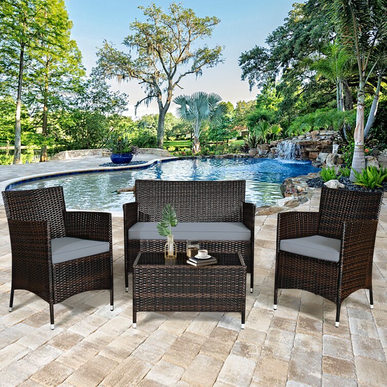 Latitude Run Satrogan 8 Piece Rattan Seating Group with Cushions